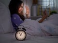 An Asian woman is using a smartphone to make video calls with her boyfriend in bed before going to bed at night. Smartphone Royalty Free Stock Photo