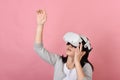 Asian woman using vr glasses, Hand grabbing something from virtual reality headset, Young woman having fun with new experience Royalty Free Stock Photo