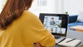 Asian woman video call conference, online remote meeting with business coworker, at home. New normal lifestyle Royalty Free Stock Photo