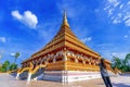 Asian woman visit Golden ancient pagoda of Phra Mahathat Kaen Nakhon temple, Thai traditional religious histoty travel attraction