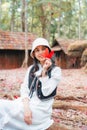 Asian woman visitting and enjoying with red maple foliage and wooden hut in School of Political and Military at Phu Hin Rong Kla Royalty Free Stock Photo