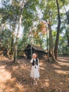 Asian woman visitting and enjoying with red maple foliage and wooden hut in School of Political and Military at Phu Hin Rong Kla Royalty Free Stock Photo