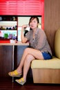 Asian woman waiting in a coffee shop