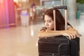 Asian woman waiting flight delay in airport Royalty Free Stock Photo