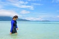 Asian woman walking in the sea at travel to Koh Lipe island Royalty Free Stock Photo