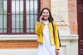 Asian woman walking on the street, wearing cute trendy outfit and talking om her smart phone. City Urban Asian girl talking on her Royalty Free Stock Photo