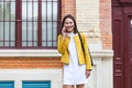 Asian woman walking on the street, wearing cute trendy outfit and talking om her smart phone. City Urban Asian girl talking on her Royalty Free Stock Photo