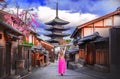 Asian woman walking Yasaka in street near Pagoda in Kyoto, Japan Royalty Free Stock Photo