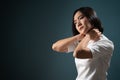 Asian woman was sick with body pain office syndrome and standing isolated over blue background Royalty Free Stock Photo