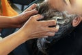Asian Woman Washing Customer Hair with Shampoo in the Hairdresser Beauty Salon Royalty Free Stock Photo