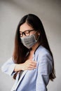 Asian woman wear face mask, hurt at chest with wear mask for virus protection Royalty Free Stock Photo