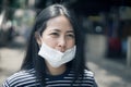 Asian woman wear protective face mask protect covid-19. Royalty Free Stock Photo