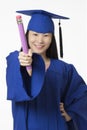 Asian woman wearing blue graduation holding pencil isolated whi Royalty Free Stock Photo