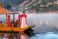 Asian woman wearing chinese traditional dress on Yunan boat at Ban rak thai village in mae hong son province, Thailand Royalty Free Stock Photo