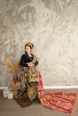 Asian woman wearing Endek woven cloth and Balinese Kebaya Royalty Free Stock Photo