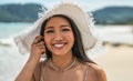 Asian woman wearing fashion summer beach hat for skin care sun protection. Beauty portrait on summer vacation travel Royalty Free Stock Photo