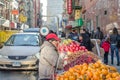 An Asian Woman Wearing a Hat Selling Fruits in Chinatown, Manhattan New York City. Street Market. Grocery Store. Royalty Free Stock Photo