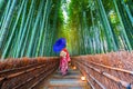 Asian woman wearing Japanese kimono to visit bamboo forest in Kyoto, Japan Royalty Free Stock Photo