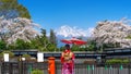 Asian woman wearing japanese traditional kimono at Fuji mountain and cherry blossom in spring, Fujinomiya in Japan