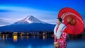 Asian woman wearing japanese traditional kimono at Fuji mountain, Kawaguchiko lake in Japan Royalty Free Stock Photo