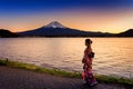 Asian woman wearing japanese traditional kimono at Fuji mountain. Sunset at Kawaguchiko lake in Japan Royalty Free Stock Photo