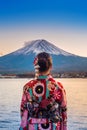 Asian woman wearing japanese traditional kimono at Fuji mountain. Sunset at Kawaguchiko lake in Japan Royalty Free Stock Photo