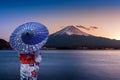 Asian woman wearing japanese traditional kimono at Fuji mountain. Sunset at Kawaguchiko lake in Japan Royalty Free Stock Photo