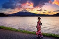 Asian woman wearing japanese traditional kimono at Fuji mountain. Sunset at Kawaguchiko lake in Japan Royalty Free Stock Photo