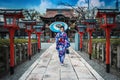 Asian woman wearing japanese traditional kimono at Rokusonno-jinja Shrine in Kyoto, Japan Royalty Free Stock Photo