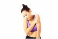 Asian woman wearing sport wear squeeze her hand on her arm .young woman arm pain during exersice isolate on whiite background