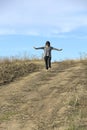 Woman takes a healthy stroll barefooted Royalty Free Stock Photo