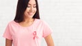 Asian Woman Wearing T-Shirt With Cancer Ribbon Over White Background Royalty Free Stock Photo