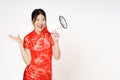 Asian woman wearing traditional cheongsam qipao dress with gesture holding megaphone isolated on white background. Happy Chinese Royalty Free Stock Photo