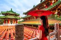Asian woman wearing traditional Chinese dress at Sanfeng Temple in Kaohsiung, Taiwan