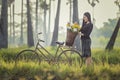 Asian woman wearing traditional thai culture,walking to go home on field Royalty Free Stock Photo