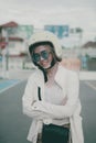 asian woman wearing white safety helmet standing on city road toothy smiling with happiness Royalty Free Stock Photo