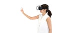 Asian woman in white dress using virtual reality glasses, play an interactive game. Side view. Future Technology Concept