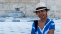 Asian woman in white fedora smiling at camera Royalty Free Stock Photo