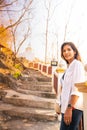 Asian woman with white pagoda background at Tham Phra Sabai temple Royalty Free Stock Photo