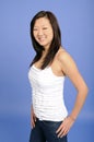 Asian woman in white tanktop and blue jeans Royalty Free Stock Photo