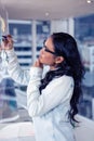 Asian woman writing on sticky notes Royalty Free Stock Photo