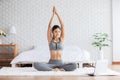 Asian woman yoga stretch online course at home