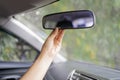 Asian women are adjusting the rearview mirror of the car Royalty Free Stock Photo