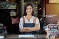 Asian women Barista smiling and using coffee machine in coffee shop counter - Working woman small business owner food and drink