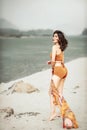 Asian women in bathing suits Posing standing on the beautiful sandy beach Royalty Free Stock Photo