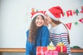 Asian woman couple giving Christmas gift in party.
