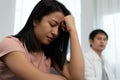 Asian women are disappointed and saddened after an argument with their husband