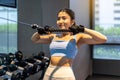 Asian women doing exercises in fitness, exercises to strengthen muscles and strength, lose body fat burning, pre-workout warm-up, Royalty Free Stock Photo