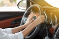 Asian women are driving cars on the road and squeeze klaxon.soft focus Royalty Free Stock Photo