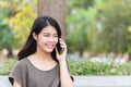 Asian women enjoy on phone call.